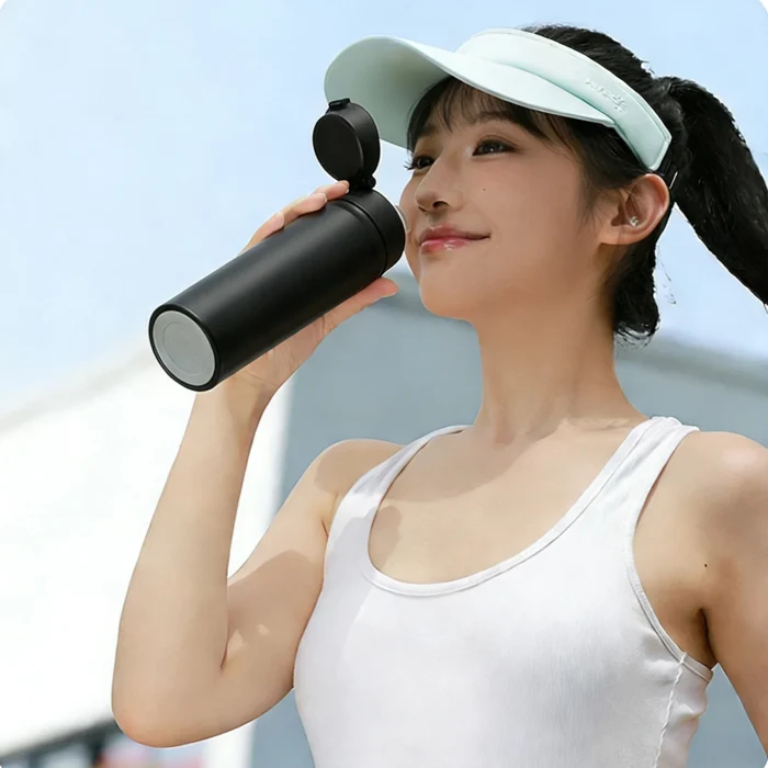 Outdoor lifestyle photography of a 600ml vacuum insulated bottle used during a mountain camping trip.