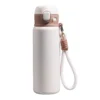 Premium cream white 480ml tea separation tumbler featuring a durable braided rope handle for portable carry.